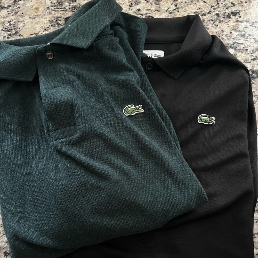 Two Lacoste polos size 7/xxl.  One classic  Hunter Green.  One sport Black